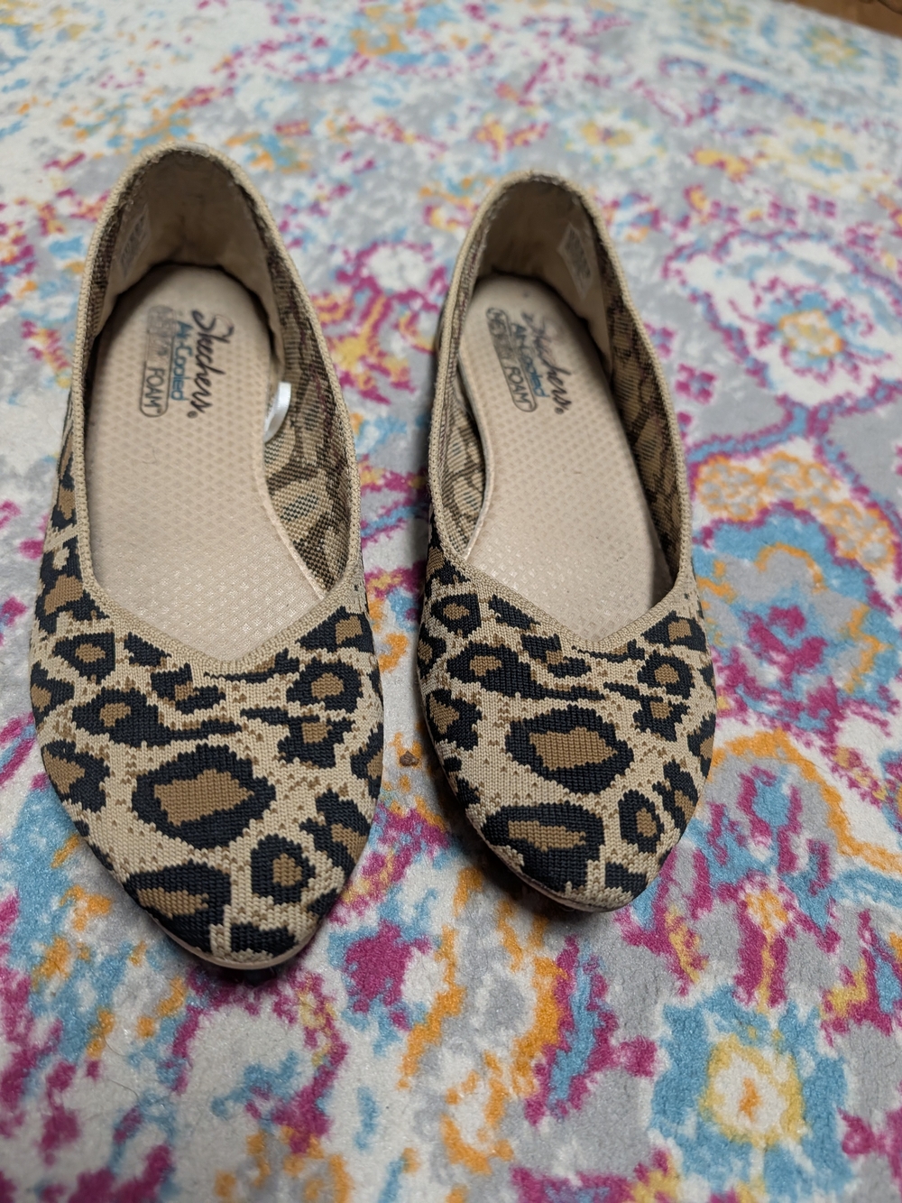 Skechers Leopard-Print Slip-On Flats in Beige and Black
